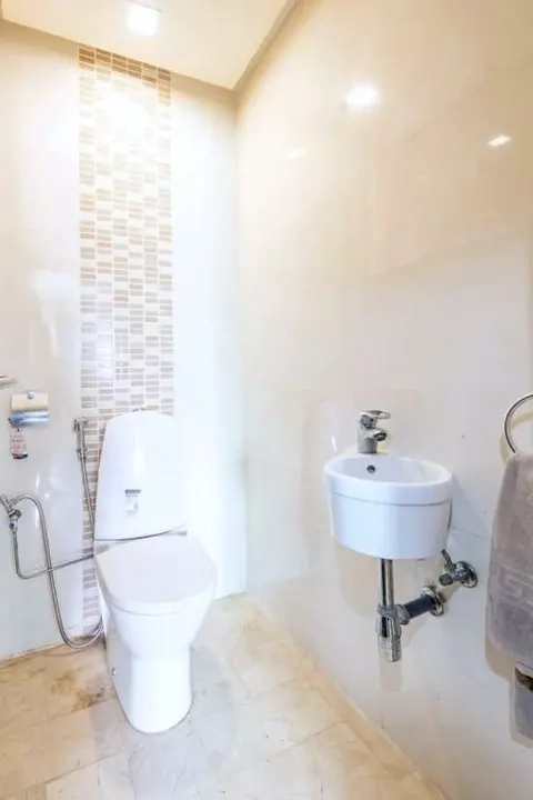The second WC with a small washbasin